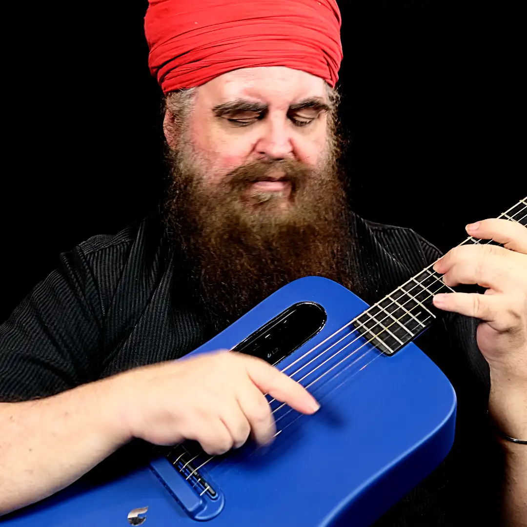 Chris Mooney-Singh with Guitar